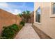 Cozy backyard featuring an outdoor pergola, lush landscaping and brick pavers at 3443 E Jasper Dr, Gilbert, AZ 85296