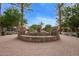 Beautiful community fountain featuring tiered levels, surrounding floral landscape, and benches at 3443 E Jasper Dr, Gilbert, AZ 85296