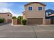 Inviting two-story home features a garage, lush landscaping and neighborhood street at 3443 E Jasper Dr, Gilbert, AZ 85296