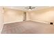 Living room offering neutral tones, carpeted floor, ceiling fan, and seamless flow for versatile arrangement at 3443 E Jasper Dr, Gilbert, AZ 85296