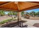 Community pavilion area with picnic table and playground for fun outdoor gatherings at 3443 E Jasper Dr, Gilbert, AZ 85296