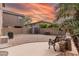Low maintenance backyard featuring rock landscaping, a storage shed, and seating area at 3488 S Bowman Rd, Apache Junction, AZ 85119