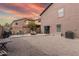 Landscaped backyard with rock groundcover, patio area, and ample space for outdoor activities at 3488 S Bowman Rd, Apache Junction, AZ 85119