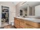 Spacious bathroom with a double sink vanity, closet, and an ample mirror at 3488 S Bowman Rd, Apache Junction, AZ 85119
