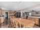 Open floor plan showcasing a dining area with a wooden table and an adjacent kitchen at 3488 S Bowman Rd, Apache Junction, AZ 85119