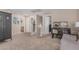 Hallway landing area with a peek into a bathroom and bedrooms in neutral colors at 3488 S Bowman Rd, Apache Junction, AZ 85119