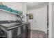 Laundry room features modern appliances, overhead storage, and a convenient entryway at 3488 S Bowman Rd, Apache Junction, AZ 85119