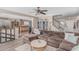 Open-concept living room showcasing a comfortable sofa, connection to the kitchen, and bright, airy space with modern flooring at 3488 S Bowman Rd, Apache Junction, AZ 85119