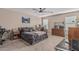 Cozy bedroom featuring neutral tones, a ceiling fan, and comfortable decor at 3488 S Bowman Rd, Apache Junction, AZ 85119