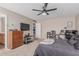 This bedroom features neutral tones, a ceiling fan, and carpet flooring at 3488 S Bowman Rd, Apache Junction, AZ 85119