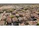 An aerial shot captures a dense neighborhood with uniform rooftops, highlighting community planning and residential living at 3488 S Bowman Rd, Apache Junction, AZ 85119