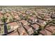 A vast aerial view highlights a neighborhood with uniform rooftops and structured streets, showcasing suburban planning and community design at 3488 S Bowman Rd, Apache Junction, AZ 85119