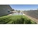 Relaxing backyard featuring artificial turf, a pool and ample patio space at 3914 E French Trotter St, San Tan Valley, AZ 85140