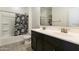 Bathroom featuring a tub and shower combo with double sinks, combining style and convenience at 3914 E French Trotter St, San Tan Valley, AZ 85140
