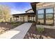 Beautiful clubhouse featuring desert landscaping, craftsman-style doors and windows, and stone and stucco exterior at 3914 E French Trotter St, San Tan Valley, AZ 85140