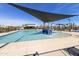 Resort-style community pool with a splash pad, ample seating, and shaded areas for a relaxing day outdoors at 3914 E French Trotter St, San Tan Valley, AZ 85140