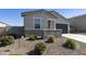 Inviting single-Gathering home with desert landscaping, gravel yard, and a two-car garage at 3914 E French Trotter St, San Tan Valley, AZ 85140