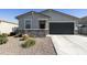 Charming single-story home with a two-car garage and low-maintenance desert landscaping at 3914 E French Trotter St, San Tan Valley, AZ 85140