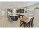 Open-concept kitchen features a large island, breakfast bar, dining area and stainless steel appliances at 3914 E French Trotter St, San Tan Valley, AZ 85140