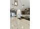 Stylish kitchen featuring granite countertops, dark cabinetry, and modern pendant lighting at 3914 E French Trotter St, San Tan Valley, AZ 85140