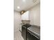 Practical laundry room includes modern appliances and ample storage space, offering convenience and organization at 3914 E French Trotter St, San Tan Valley, AZ 85140