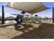 Community playground with slides, climbing structures, and shade coverings for safe and fun outdoor play at 3914 E French Trotter St, San Tan Valley, AZ 85140