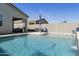 A refreshing backyard pool with a waterfall feature and plenty of seating at 3914 E French Trotter St, San Tan Valley, AZ 85140