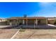 Expansive backyard with a covered patio offers an inviting space for relaxation and outdoor activities at 4004 W Myrtle Ave, Phoenix, AZ 85051