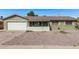 Charming single-story home featuring a desert landscape and a convenient two-car garage at 4004 W Myrtle Ave, Phoenix, AZ 85051