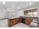 Updated kitchen featuring stainless steel appliances, granite counters, and abundant cabinet space at 4004 W Myrtle Ave, Phoenix, AZ 85051