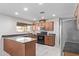 Well-lit kitchen featuring modern appliances, a breakfast bar, and ample counter space at 4004 W Myrtle Ave, Phoenix, AZ 85051