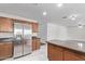Bright kitchen featuring a stainless steel refrigerator and plenty of storage space at 4004 W Myrtle Ave, Phoenix, AZ 85051