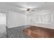A living room with light walls, stylish flooring and ceiling fan at 4004 W Myrtle Ave, Phoenix, AZ 85051