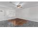 A living room with light walls, stylish flooring and ceiling fan at 4004 W Myrtle Ave, Phoenix, AZ 85051