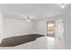 A living room with light walls, stylish flooring and a glass sliding door at 4004 W Myrtle Ave, Phoenix, AZ 85051