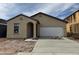A charming single-story home featuring a neutral stucco finish, tile roof, and an attached two-car garage at 4234 E Kolin Ln, San Tan Valley, AZ 85143
