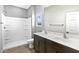 Bathroom featuring dual sinks, modern vanity, and shower at 42875 W Vincent Dr, Maricopa, AZ 85138