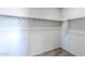 Walk-in closet provides ample storage with built-in shelving and rods at 42875 W Vincent Dr, Maricopa, AZ 85138