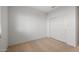 Bright bedroom features carpet flooring and a closet with sliding doors at 42900 W Peters Dr, Maricopa, AZ 85138
