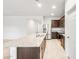 Spacious kitchen with stainless steel appliances, granite counters, and an extended island at 42925 W Palo Amarillo Rd, Maricopa, AZ 85138