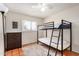 Bright bedroom with a bunk bed, a neutral rug and window allowing for natural light at 4702 W Northview Ave, Glendale, AZ 85301