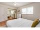 Comfortable bedroom with lots of light, neutral walls, tiled floors and closet at 4702 W Northview Ave, Glendale, AZ 85301