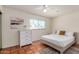 Inviting bedroom featuring tile floors, natural light, and neutral walls, creating a cozy and serene atmosphere at 4702 W Northview Ave, Glendale, AZ 85301
