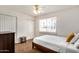 Well-lit bedroom with large window and closet, perfect for relaxation and comfort at 4702 W Northview Ave, Glendale, AZ 85301