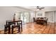 Bright dining area with a large table and sliding door access to the backyard at 4702 W Northview Ave, Glendale, AZ 85301