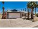 Single-story home with a two-car garage and low-maintenance desert landscaping at 4702 W Northview Ave, Glendale, AZ 85301