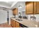 Bright kitchen with granite countertops, stainless steel sink, and adjacent dining area for easy entertaining at 4702 W Northview Ave, Glendale, AZ 85301