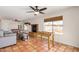 Spacious living room with tile floors, fireplace and bright natural light at 4702 W Northview Ave, Glendale, AZ 85301