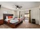 Spacious primary bedroom with ceiling fan and sliding glass doors to the Arizona Room, creating a private retreat at 4702 W Northview Ave, Glendale, AZ 85301