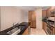 Kitchen featuring wooden cabinets, stainless steel appliances and granite countertops at 4808 N 24Th St # 204, Phoenix, AZ 85016